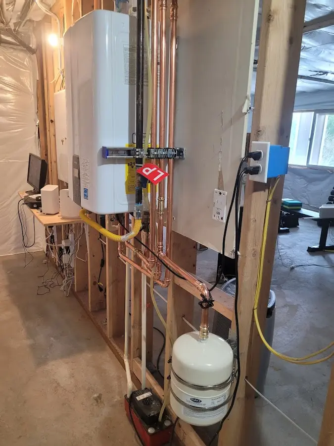 Licensed plumber repairing a kitchen sink in Fredon