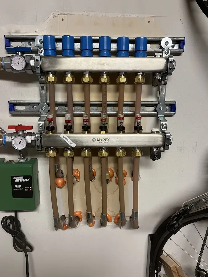 Plumber performing Water Heater Repair at a residential property in Fredon